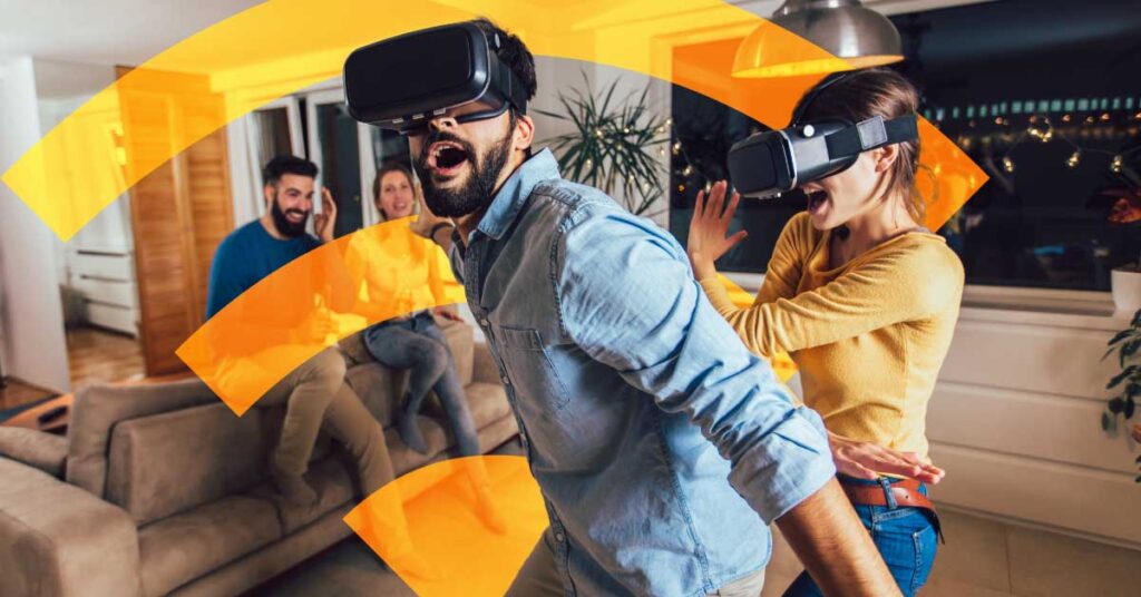 Δύο άτομα διασκεδάζουν με VR headsets, απολαμβάνοντας την εμπειρία με γρήγορο internet από τη NetFlash.